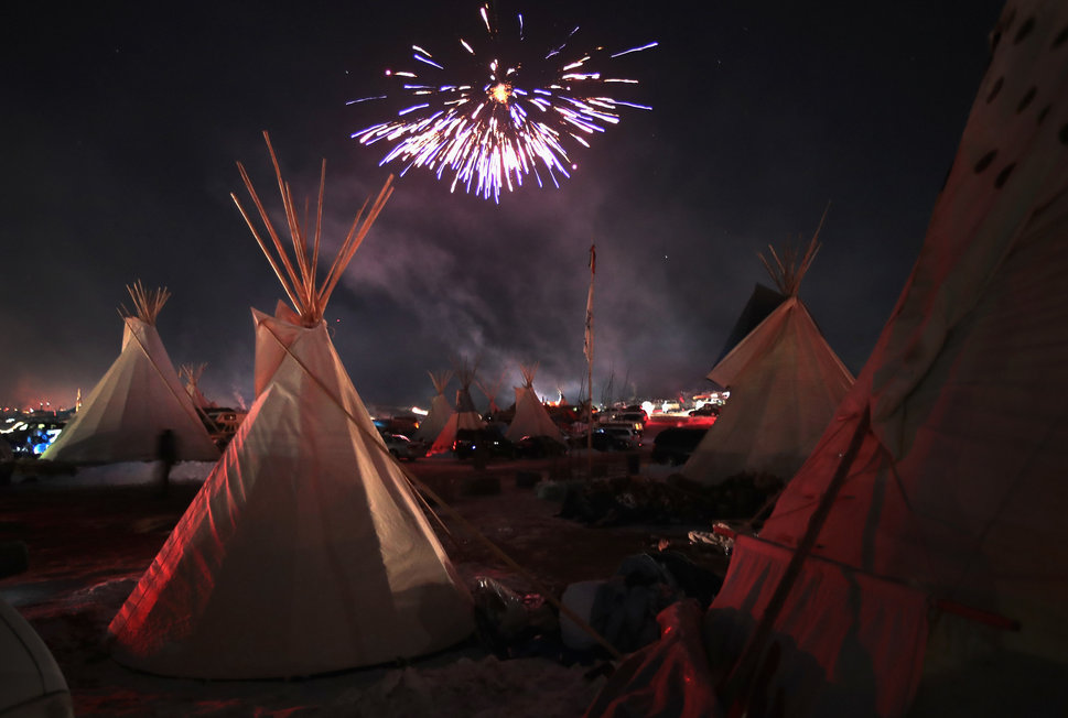fireworks above tipis at Standing Rock in celebration on Dec 4, 2016